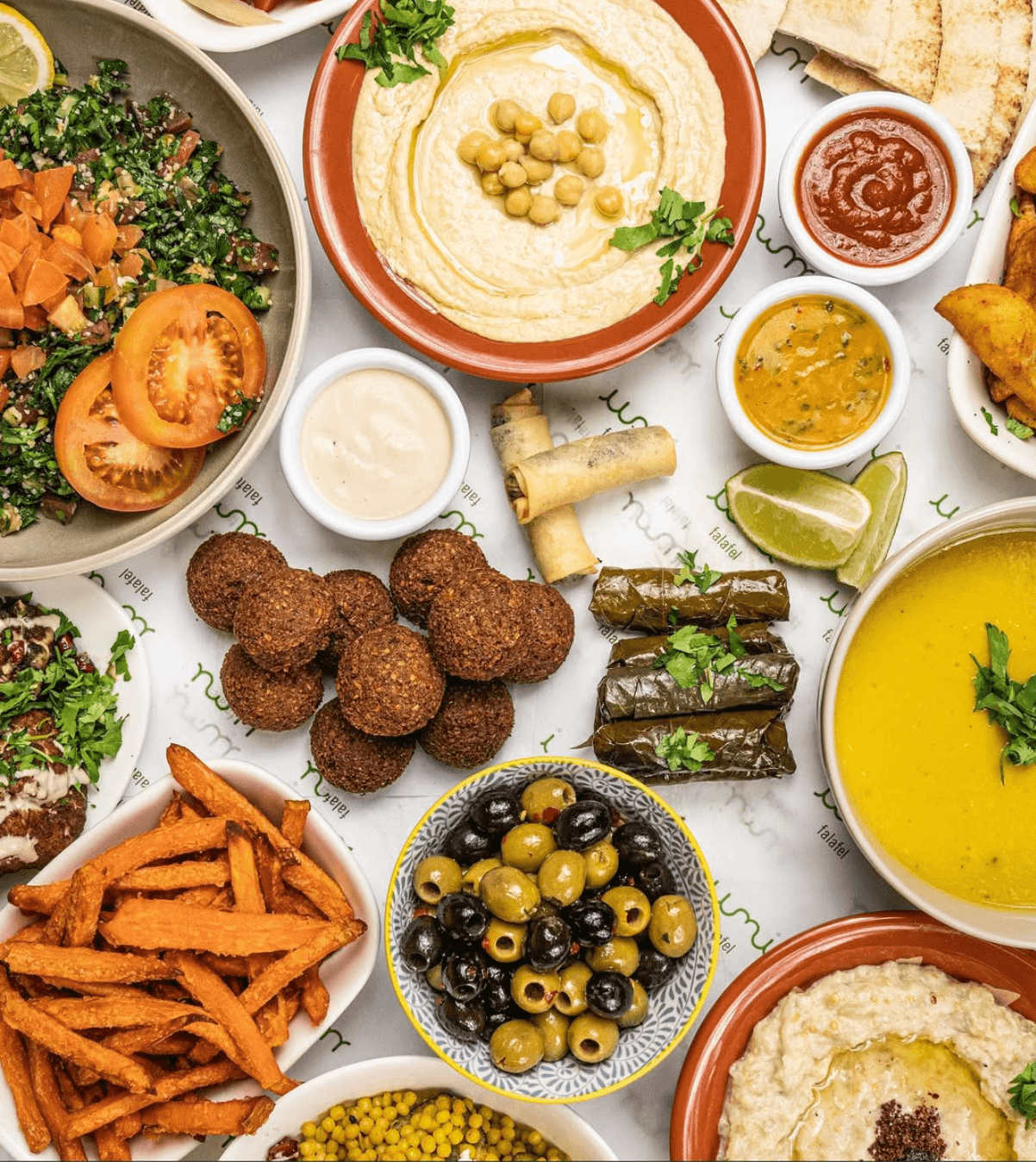 An Umi spread of hummus, falafel, tabouleh, vine leaves, sweet potato fries and lentil soup